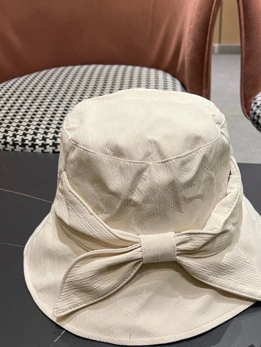 CHANEL Cream Bucket Hat with Black and Gold CC Logo